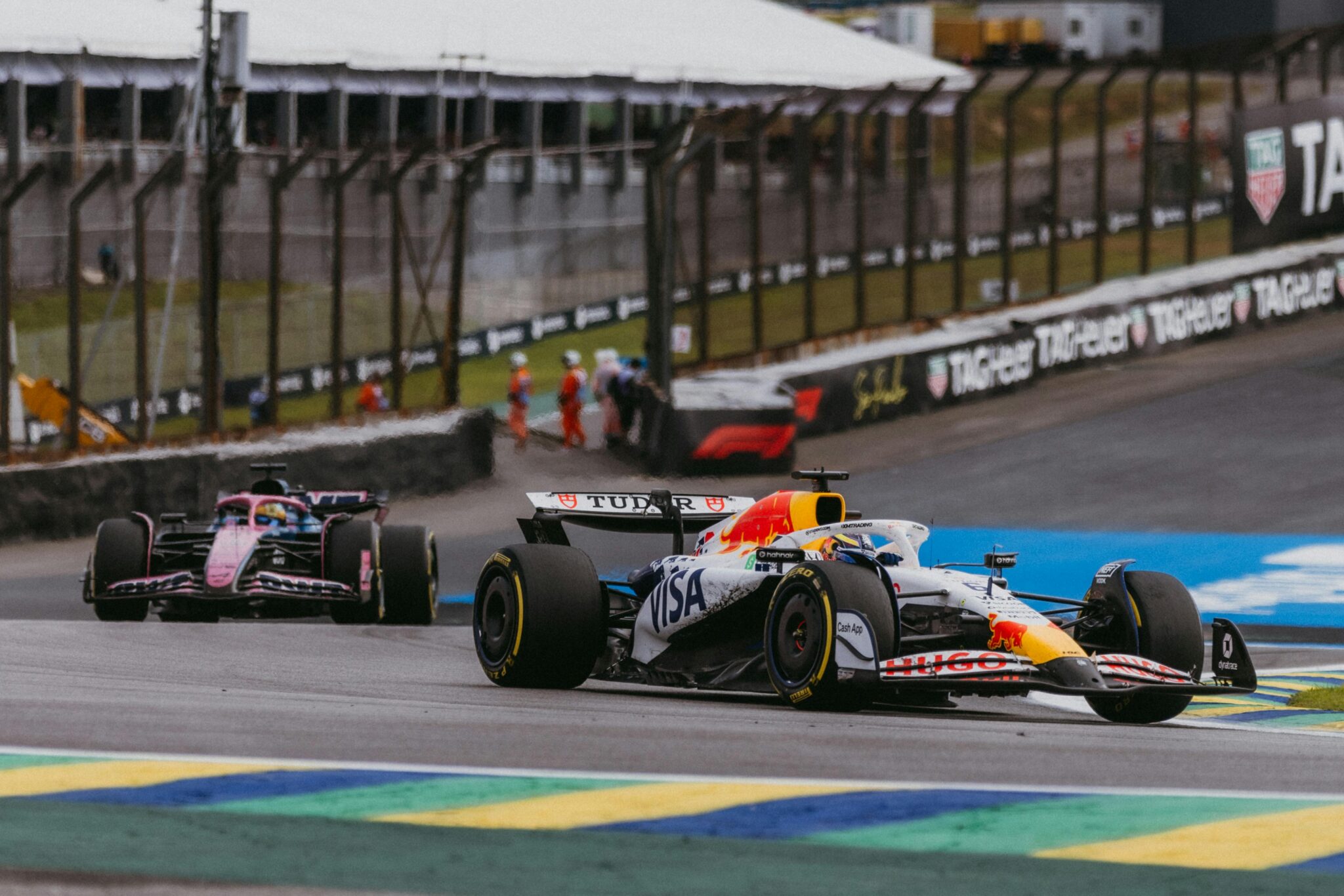 Exciting Formula 1 action with red bull cars racing in São Paulo, Brazil.